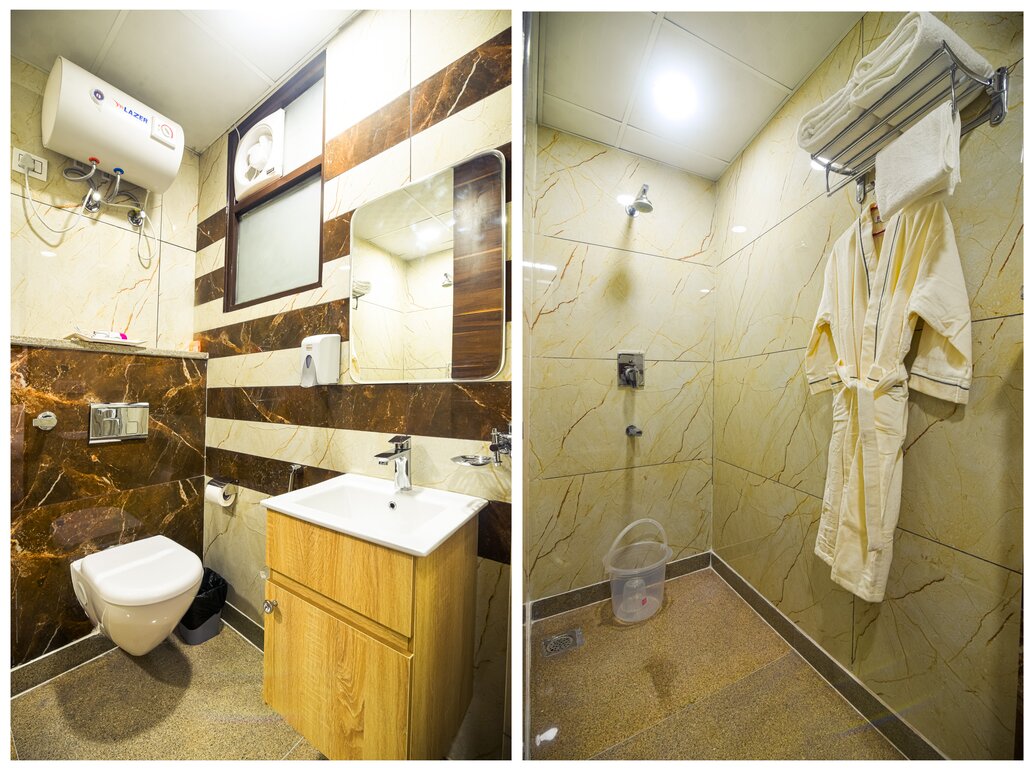 Ensuite bathroom with shower, Hot/ cold water, Fresh Towels, toilet roll, dental kit, shampoo, soap, etc.