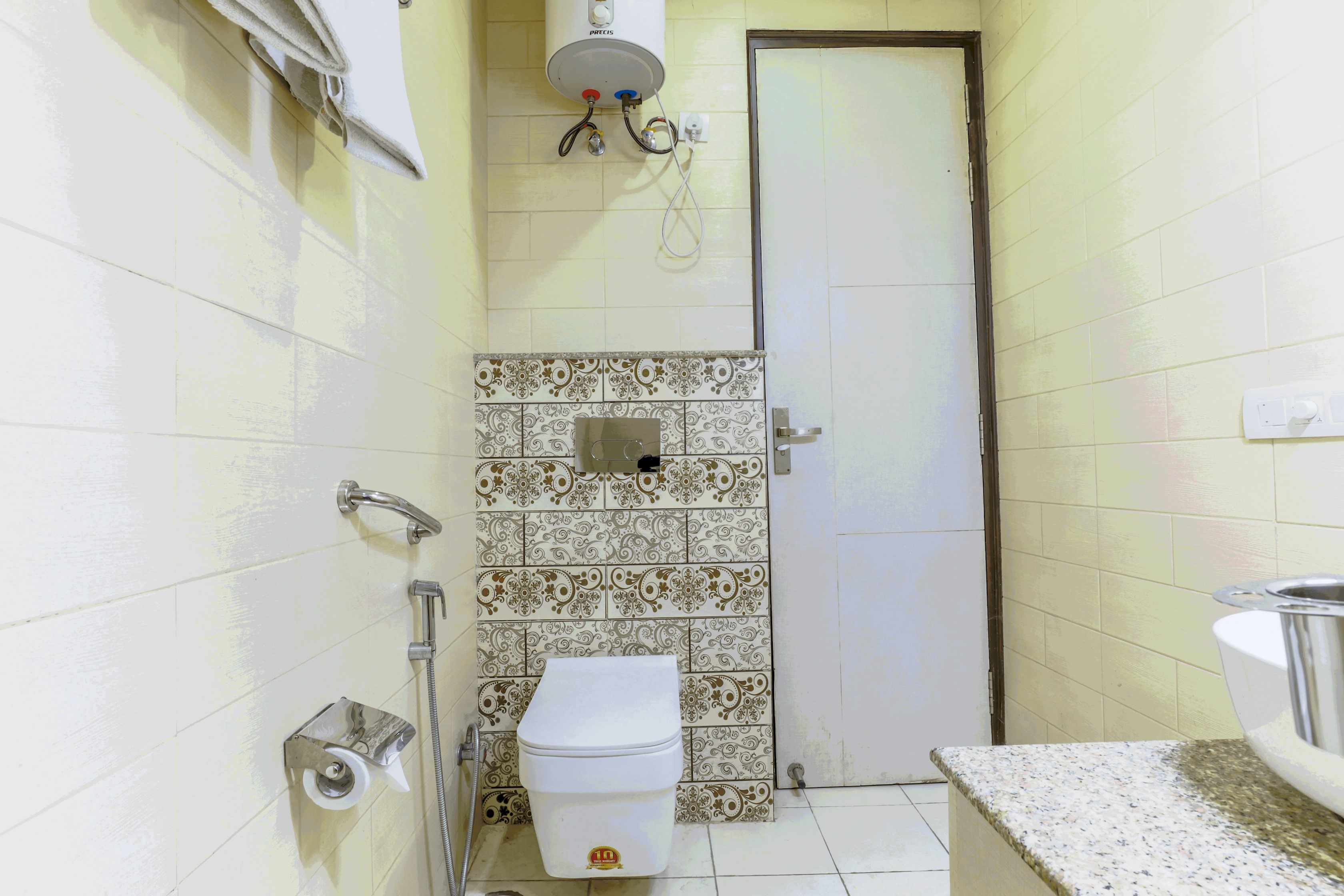 Parfait Street Ensuite Oasis: Your private attached bathroom boasts contemporary fixtures, a rejuvenating shower, a convenient sink, and a cozy toilet for the ultimate convenience and comfort during your stay