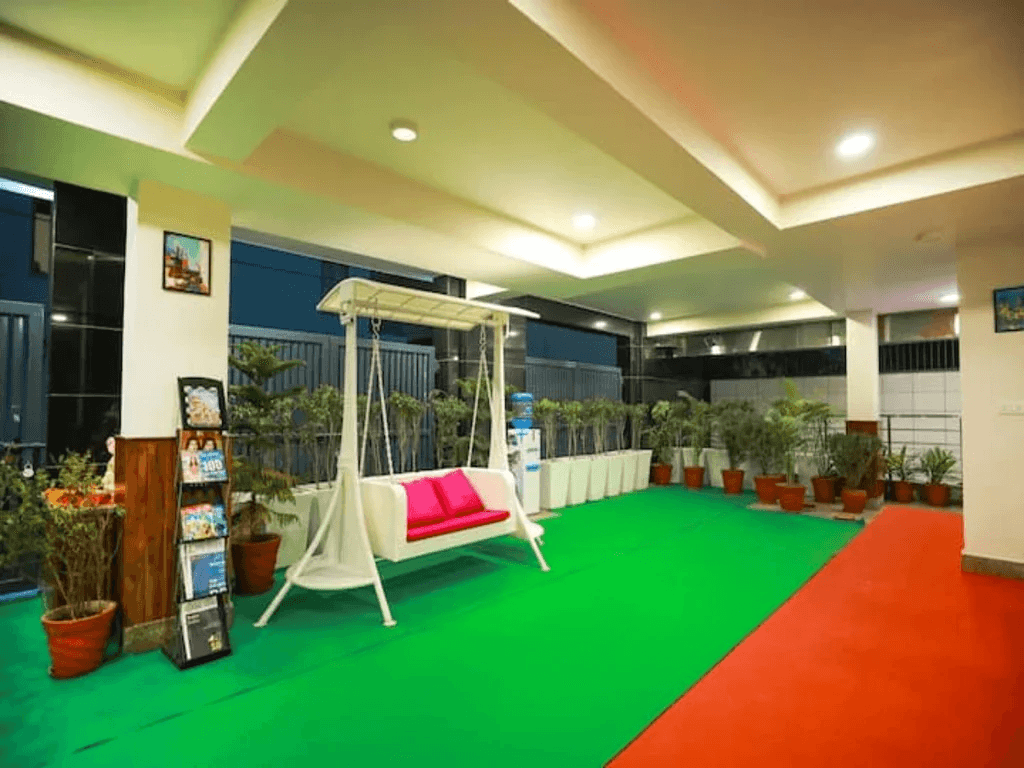 "Step into a world of warmth and hospitality - where traditional charm meets modern comfort, in the welcoming embrace of our reception with a traditional jhula swing."