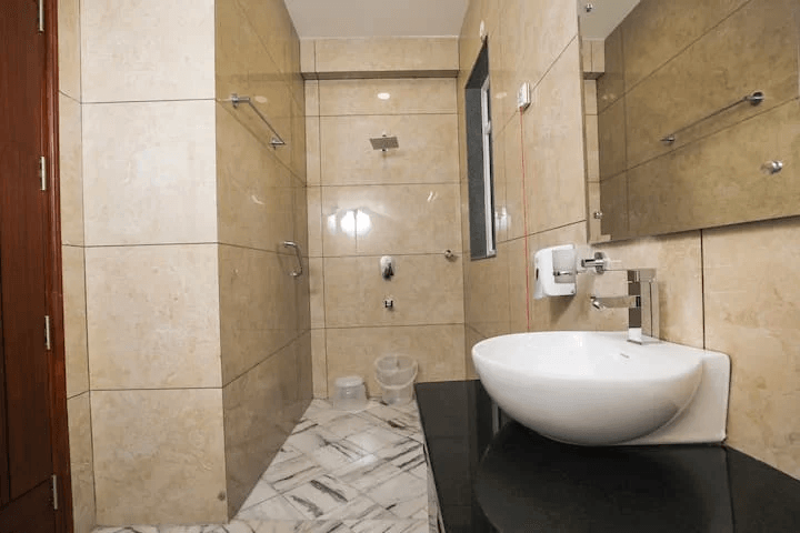 An inviting and safe bathroom environment, featuring grab bars for added accessibility.