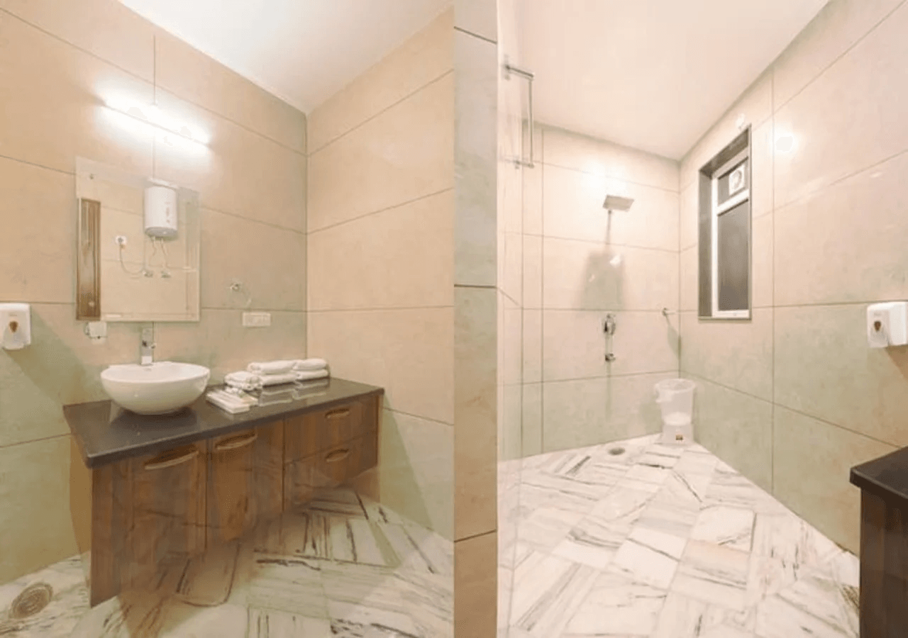 A private attached bathroom featuring modern fixtures, a shower, sink, and toilet for convenience and comfort