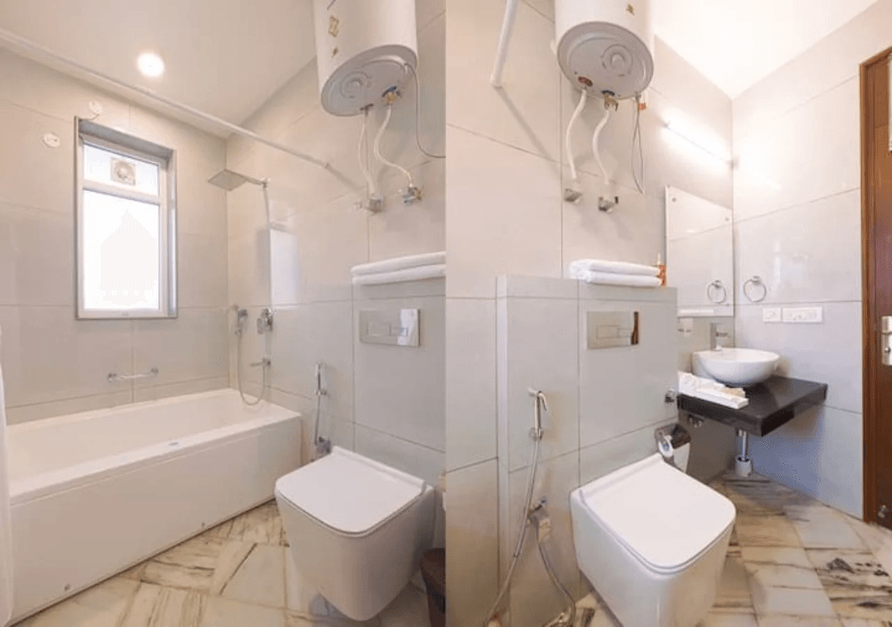 A private attached bathroom featuring modern fixtures, a shower, sink, and toilet for convenience and comfort.